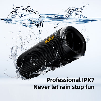 Black QCY SP7 speaker submerged in water, showcasing its IPX7 rating.