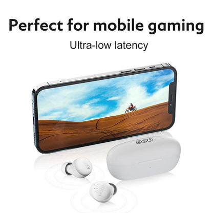 White QCY T17 earbuds beside charging case and smartphone, highlighting ultra-low latency for mobile gaming experience